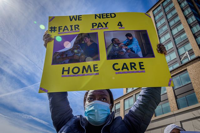 Participant seen holding a sign at the protest. Home care workers, seniors, and people with disabilities held a rally at the Fordham Bus Plaza in the Bronx in support of fair pay, March 12, 2021